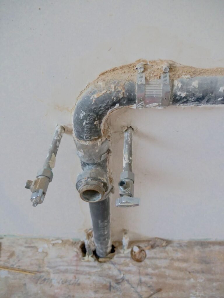 Exposed pipes during slab leak repair