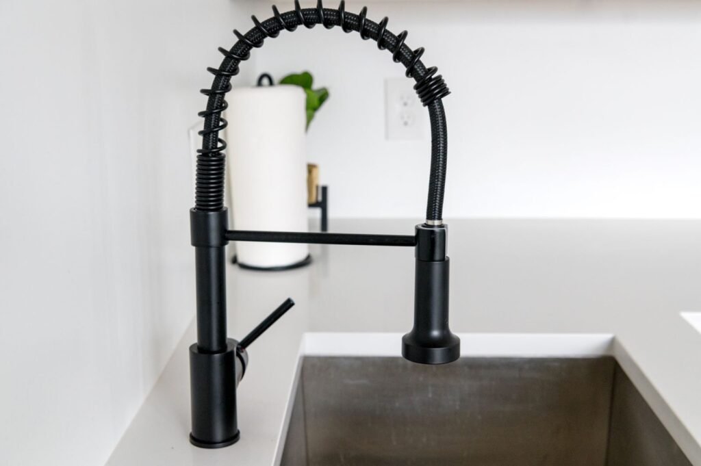 Black kitchen faucet with filtered water