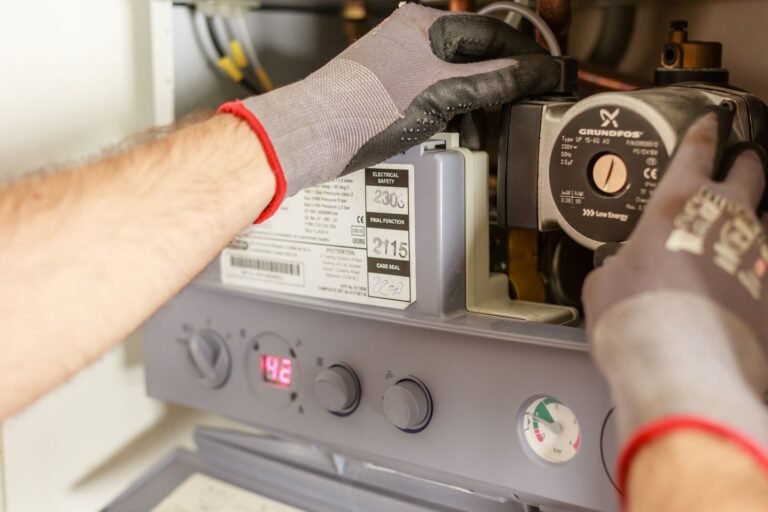 Plumber servicing a water heater in Lombard, IL