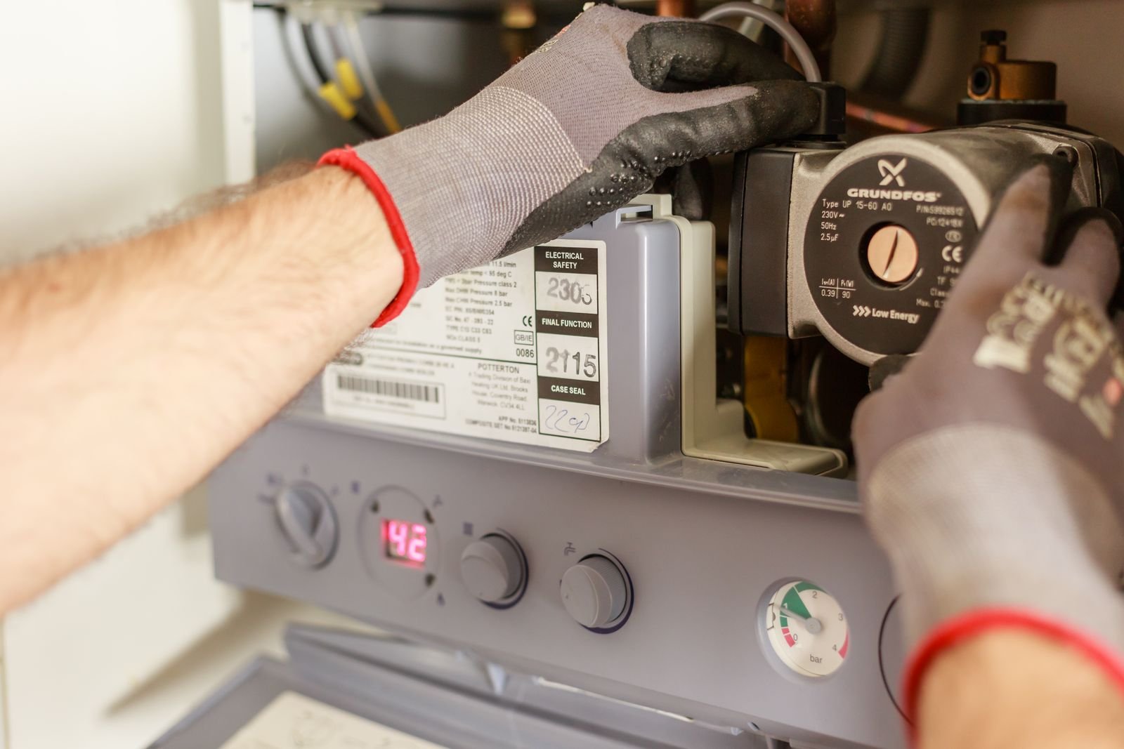 Plumber servicing a water heater in Lombard, IL